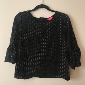 Black blouse with vertical stacked dot pattern
